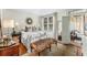 Bright bedroom with a plush bed and a sitting area at 2260 Peachtree Nw Rd # D-3, Atlanta, GA 30309