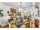 Bright dining room with glass-top table and hardwood floors at 2260 Peachtree Nw Rd # D-3, Atlanta, GA 30309