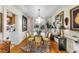 Charming dining room with glass table and hardwood floors at 2260 Peachtree Nw Rd # D-3, Atlanta, GA 30309