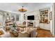 Spacious living room with fireplace and built-in shelving at 2260 Peachtree Nw Rd # D-3, Atlanta, GA 30309