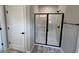 Bathroom featuring a glass enclosed shower with herringbone tile surround at 15 Cambridge Ln, Dallas, GA 30157
