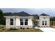 Charming one-story home with brick and siding, well-manicured lawn, and inviting blue door at 15 Cambridge Ln, Dallas, GA 30157