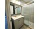 Stylish bathroom with gray vanity and walk-in shower at 755 Tanner Rd, Dacula, GA 30019