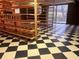 Unfinished basement with shelving and checkered floor at 4890 Prince Se Rd, Smyrna, GA 30082