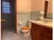 Bathroom with light blue tile and wood vanity at 4890 Prince Se Rd, Smyrna, GA 30082