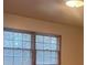 Simple bedroom with two windows and neutral walls at 4890 Prince Se Rd, Smyrna, GA 30082