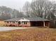 Brick ranch house with carport and large yard at 4890 Prince Se Rd, Smyrna, GA 30082