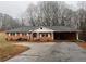 Brick ranch house with a long driveway at 4890 Prince Se Rd, Smyrna, GA 30082