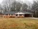 Brick ranch house with a yard at 4890 Prince Se Rd, Smyrna, GA 30082