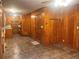 Long hallway with wood paneling and access to kitchen at 4890 Prince Se Rd, Smyrna, GA 30082