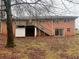 Back of house with deck and storage below at 4890 Prince Se Rd, Smyrna, GA 30082