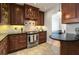 Updated kitchen with dark wood cabinets and granite countertops at 907 Lenox Hill Ne Ct, Atlanta, GA 30324