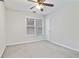 Well-lit bedroom with carpet and window at 2155 Washington Dr, Douglasville, GA 30135