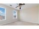 Bright bedroom with ceiling fan and neutral carpeting at 2155 Washington Dr, Douglasville, GA 30135