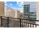 A balcony offers city views and a glimpse of urban architecture at 565 Peachtree Ne St # 804, Atlanta, GA 30308