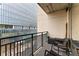 Balcony featuring black metal railings, chairs, and views of the urban landscape at 565 Peachtree Ne St # 804, Atlanta, GA 30308