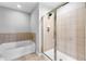 Bathroom with soaking tub and a separate shower stall at 565 Peachtree Ne St # 804, Atlanta, GA 30308