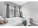 Bedroom with large windows and neutral decor at 565 Peachtree Ne St # 804, Atlanta, GA 30308