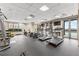 Community gym with treadmills, elliptical, weights, and televisions at 565 Peachtree Ne St # 804, Atlanta, GA 30308