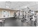 Community gym with weight machines, treadmills, and floor to ceiling mirrors at 565 Peachtree Ne St # 804, Atlanta, GA 30308