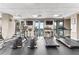 Spacious community gym with treadmills and elliptical machines overlooking the community pool at 565 Peachtree Ne St # 804, Atlanta, GA 30308