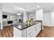 Stylish kitchen with white cabinetry, granite countertops and hardwood floors at 565 Peachtree Ne St # 804, Atlanta, GA 30308