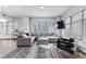 Open-concept living room featuring modern furniture, large windows, and stylish decor at 565 Peachtree Ne St # 804, Atlanta, GA 30308