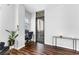 Cozy living room with hardwood floors, a desk, and a door leading to a balcony at 565 Peachtree Ne St # 804, Atlanta, GA 30308