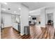 View of open concept living room and kitchen with stainless steel appliances and hardwood floors at 565 Peachtree Ne St # 804, Atlanta, GA 30308