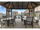 Elegant outdoor seating under covered structure, offering views of the pool area and surrounding cityscape at 565 Peachtree Ne St # 804, Atlanta, GA 30308