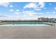 Community rooftop pool with lounge chairs and city views at 565 Peachtree Ne St # 804, Atlanta, GA 30308