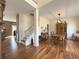 Formal dining room with hardwood floors, a wood hutch, and a table set for four at 1588 School House Run, Dacula, GA 30019