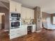 Built-in kitchen desk with granite countertop and white cabinets at 1588 School House Run, Dacula, GA 30019