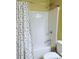 Small bathroom with shower/tub combo and polka dot curtain at 175 Mary Wallace Way, Dallas, GA 30157