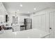 White kitchen with quartz countertops and stainless steel appliances at 1186 Haven Brook Ne Ln, Brookhaven, GA 30319