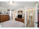 Bright bedroom with dresser, views of the hallway and kitchen at 219 Valerie Cir, Hiram, GA 30141