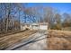 House exterior showcasing a long driveway and mature trees at 219 Valerie Cir, Hiram, GA 30141