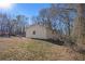 Side view of a ranch house with mature trees at 219 Valerie Cir, Hiram, GA 30141