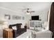 Cozy living room featuring a brown sofa and two armchairs at 219 Valerie Cir, Hiram, GA 30141