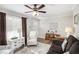 Living room with brown sofa, armchairs, and ceiling fan at 219 Valerie Cir, Hiram, GA 30141