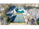 Aerial view of tennis courts, pool, and lake at 3173 Woodrow Ne Way, Brookhaven, GA 30319