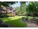 Landscaped backyard with firepit and seating area at 3173 Woodrow Ne Way, Brookhaven, GA 30319