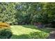 Landscaped backyard with lush green grass at 3173 Woodrow Ne Way, Brookhaven, GA 30319