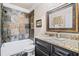 Basement bathroom with slate tile shower and granite vanity at 3173 Woodrow Ne Way, Brookhaven, GA 30319