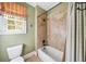 Bathroom with shower/tub combo and tile surround at 3173 Woodrow Ne Way, Brookhaven, GA 30319