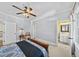 Cozy bedroom with ensuite bath and ceiling fan at 3173 Woodrow Ne Way, Brookhaven, GA 30319