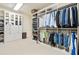 Large walk-in closet with custom built-ins and organizers at 3173 Woodrow Ne Way, Brookhaven, GA 30319