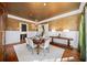 Formal dining room with detailed wall and chandelier at 3173 Woodrow Ne Way, Brookhaven, GA 30319