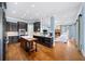 Gourmet kitchen featuring dark cabinetry, quartz countertops, and a large island at 3173 Woodrow Ne Way, Brookhaven, GA 30319