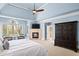 Main bedroom with fireplace, sitting area, and large windows at 3173 Woodrow Ne Way, Brookhaven, GA 30319